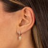  Diamond Pavé Dangling Cross Huggie Earring 14K - Adina Eden's Jewels