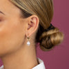  Dangling Pearl X Oval Hoop Earring - Adina Eden's Jewels
